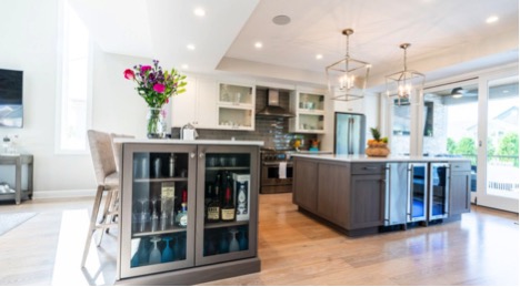 Open airy kitchen with built-in wine fridge in home built by New Jersey custom home builder